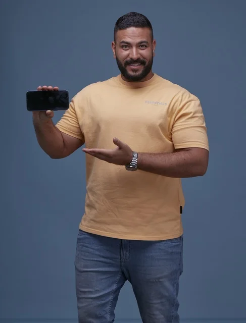 Smiling Saudi Man Holding Empty Smartphone Mockup Screen