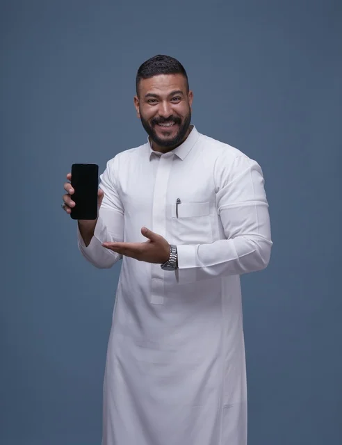 Saudi Man in White Thobe Holding Blank Smartphone