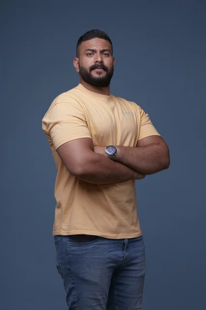Confident Saudi Man in Yellow T-shirt Studio Portrait