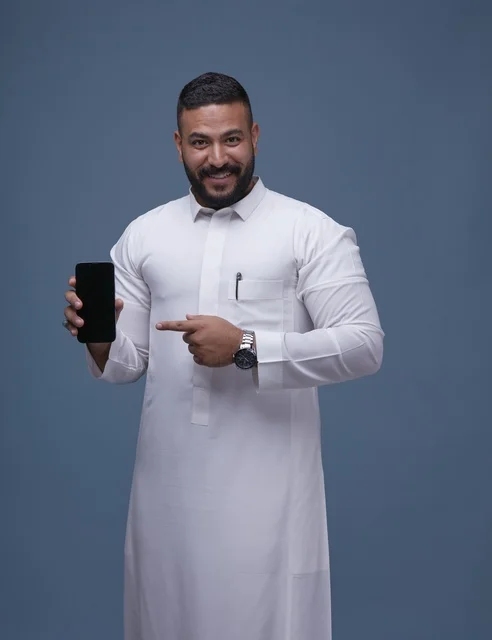 Saudi Man Pointing at Blank Smartphone Screen