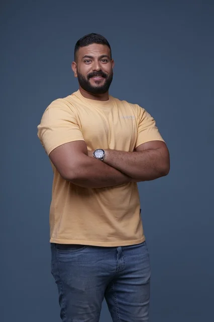 Smiling Saudi Man in Yellow T-shirt Studio Portrait Shot