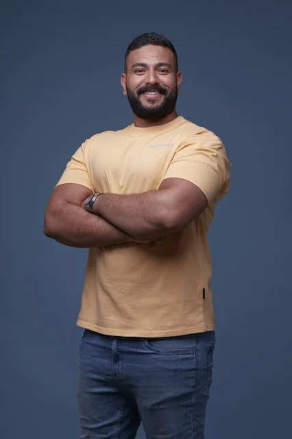 Smiling Saudi Man in Yellow T-shirt Studio Portrait