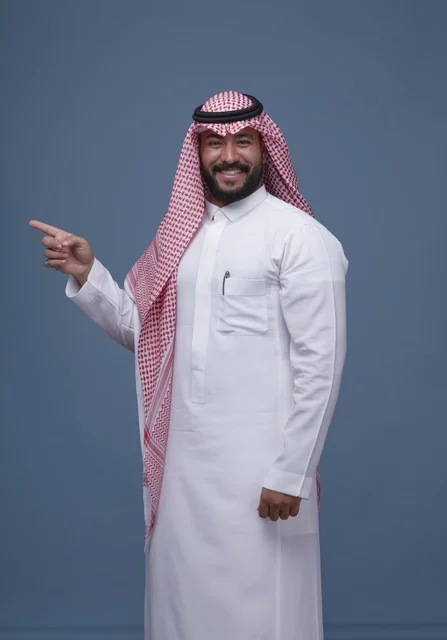 Saudi Man in Traditional Dress Pointing in Studio