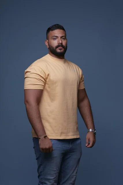 Saudi Man in Yellow T-shirt on Blue Background