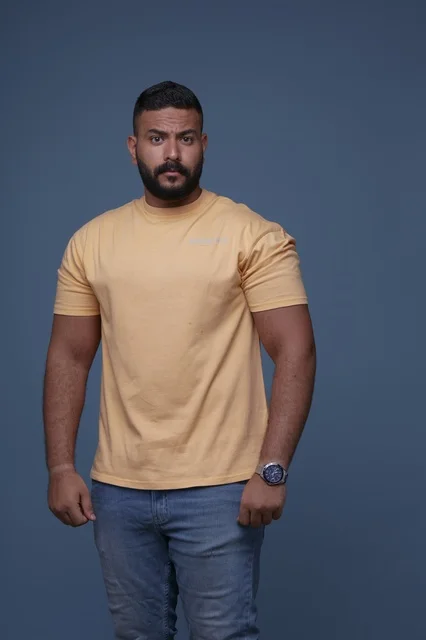 Middle Eastern Man in Yellow T-shirt Studio Portrait