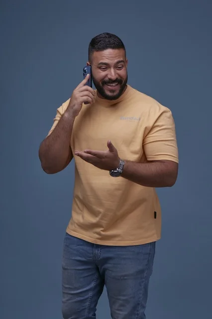 Smiling Saudi Man Talking on Smartphone in Studio