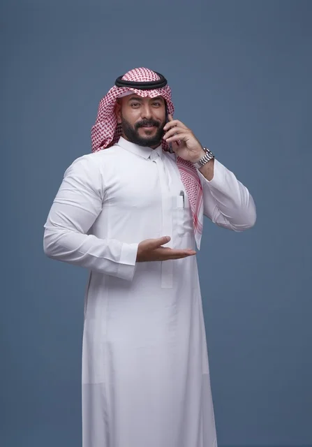 Saudi Man Talking on Smartphone in Traditional Dress