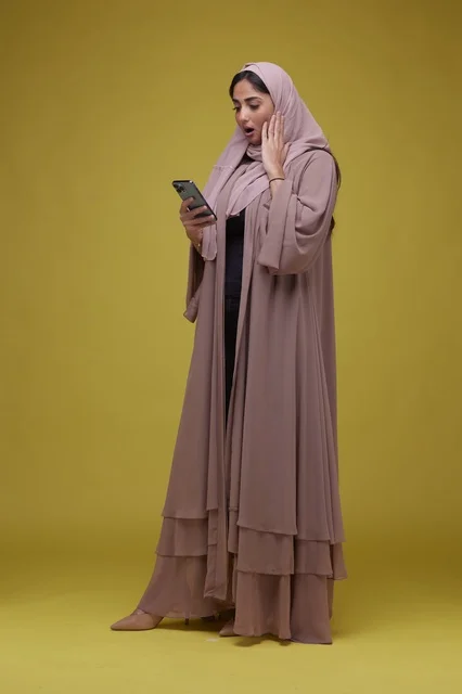 Saudi Woman Pink Abaya Smartphone Studio Surprise