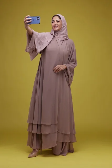 Saudi Woman in Studio Taking Smartphone Selfie