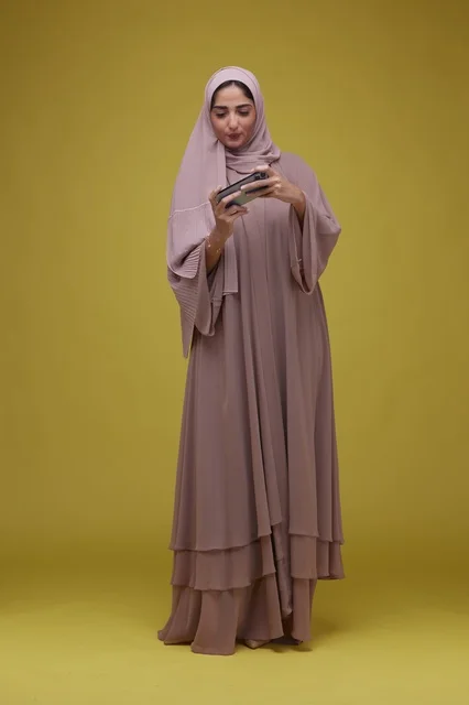 Saudi Woman Playing Mobile Game on Smartphone