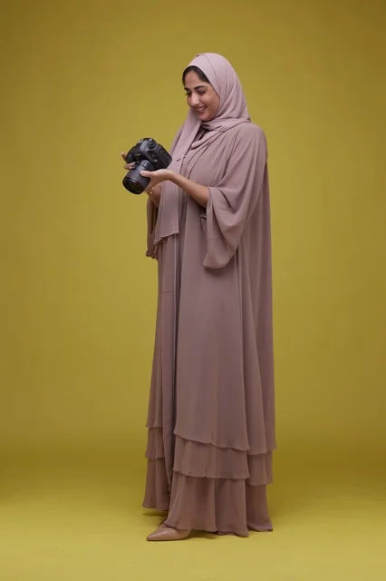 Saudi Woman Photographer with DSLR Camera in Studio