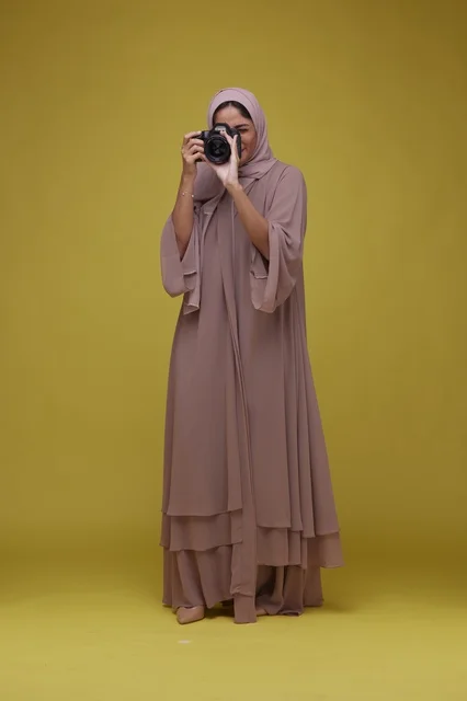 Young Saudi Woman Taking Photo with Camera