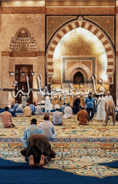A picture from the back of a group of worshipers performing prayer, the atmosphere of the blessed Ramadan, so we responded to it, Islamic decoration, worship and getting closer to God, distinctive Islamic designs and decorations