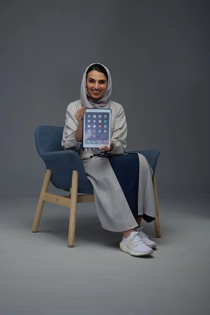 Saudi Woman with Digital Tablet in Grey Abaya