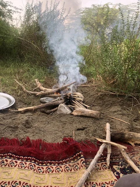 Campfire and Traditional Rug in Wadi Ghanimah Al Bahah