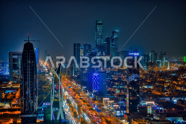 A wonderful night view of the King Abdullah Financial District (CAFD) in Riyadh, the financial and economic towers and architectural facilities, city lights and roadways for cars at night, famous tourist attractions in the Kingdom of Saudi Arabia