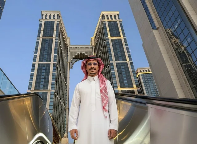 Saudi Man in Traditional Dress with Modern Skyscrapers