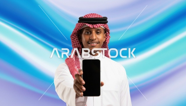 رجل سعودي يحمل هاتف ذكي بشاشة فارغة
