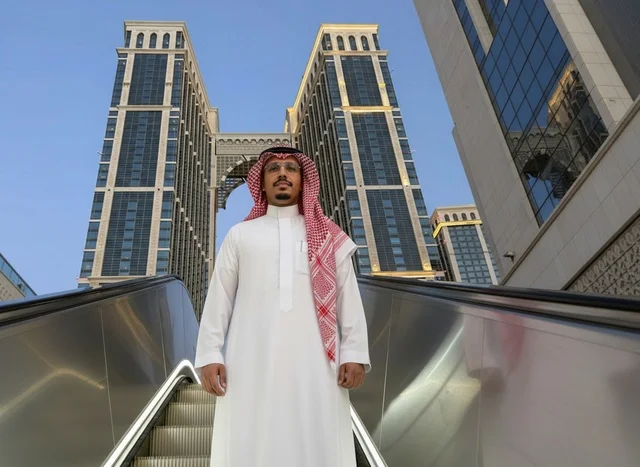 Saudi Man in Traditional Thobe by Modern Skyscrapers