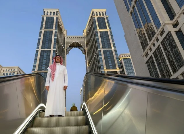 Saudi Man on Escalator Near Makkah Twin Towers