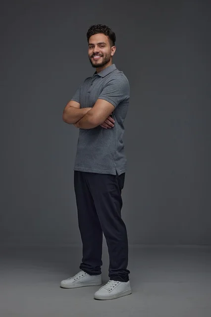 Saudi Man Standing with Crossed Arms in Studio Shot