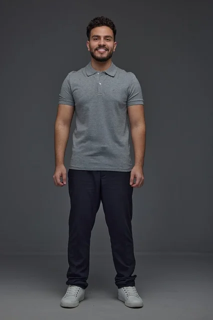 Smiling Saudi Man Standing in Studio on Grey Background