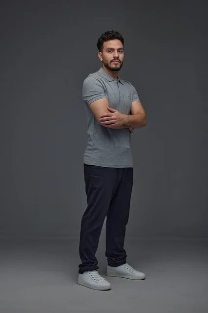 Saudi Man in Grey Polo Shirt on Grey Background