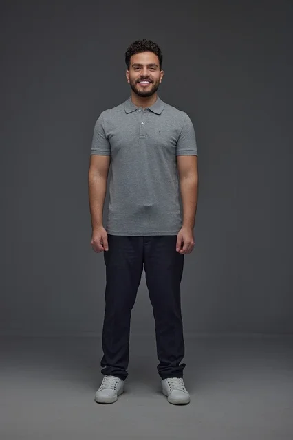 Smiling Saudi Man in Grey Polo Shirt Studio Portrait