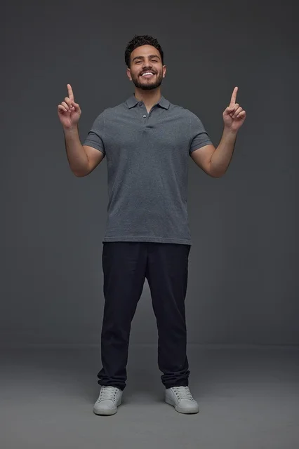 Saudi Man Pointing Upwards in Studio Portrait