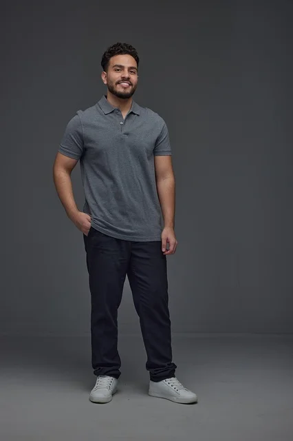 Smiling Saudi Man in Studio Portrait with Grey Background