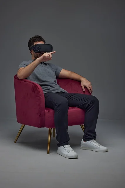 Man Using Virtual Reality Headset in Armchair