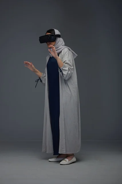 Saudi Woman Using VR Headset in Studio