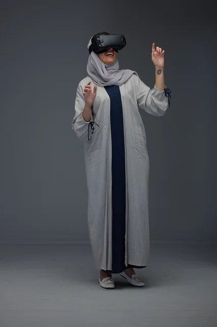 Saudi Woman Using Virtual Reality Headset in Studio