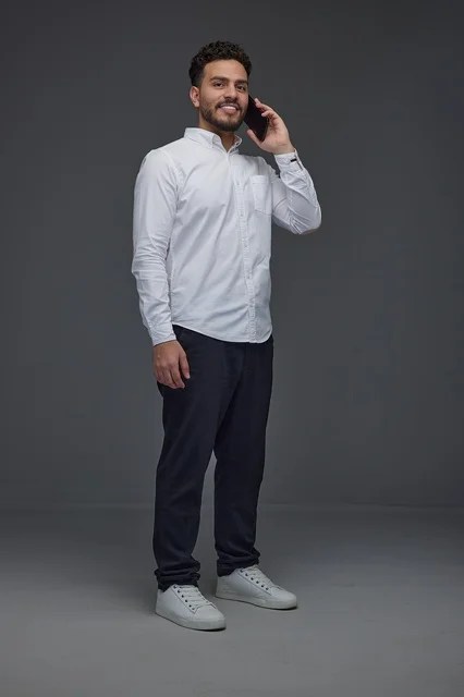 Saudi Man Talking on Smartphone in Studio Shot
