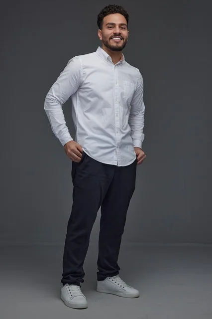 Smiling Saudi Man in White Shirt Studio Portrait