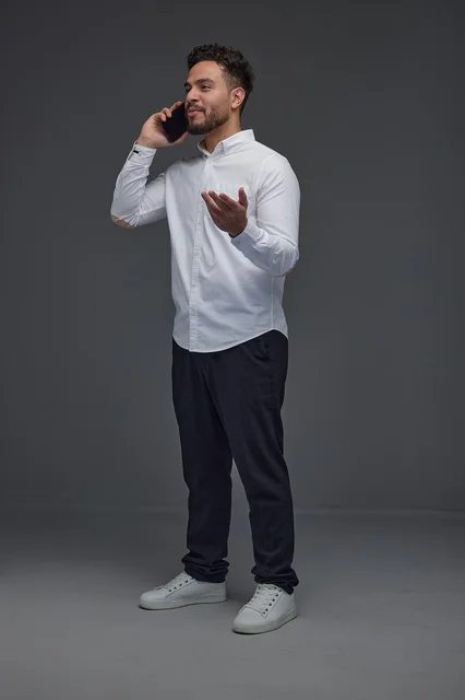 Saudi Man Talking on Smartphone in Studio