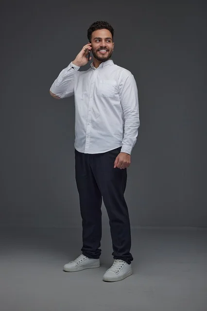 Saudi Man Talking on Smartphone in Studio Shot