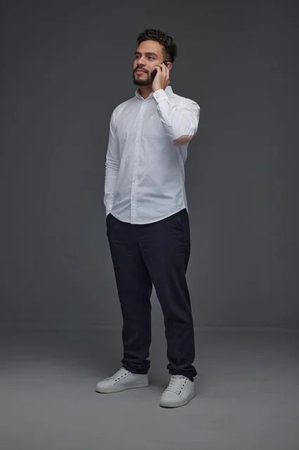 Saudi Man Talking on Mobile Phone in Studio Portrait