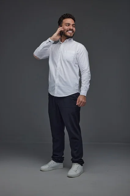 Saudi Man Talking on Smartphone in Studio Portrait