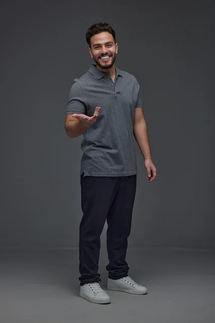 Saudi Man Smiling in Casual Attire Studio Portrait
