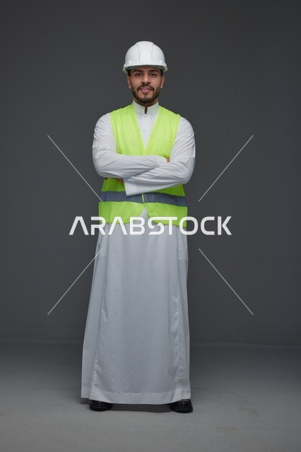 Saudi Engineer in Thobe and Safety Vest Studio Portrait