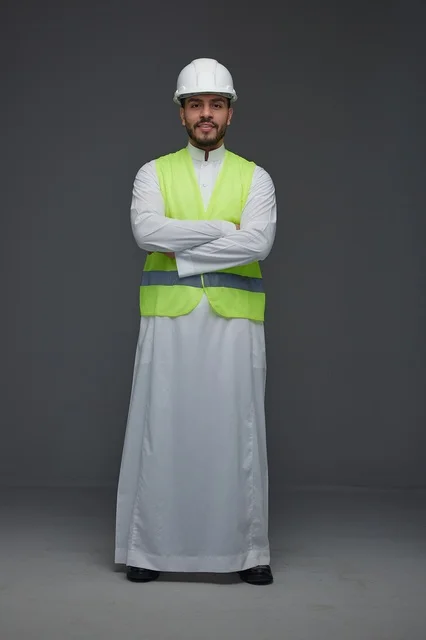 Saudi Engineer in Thobe and Safety Vest Studio Portrait