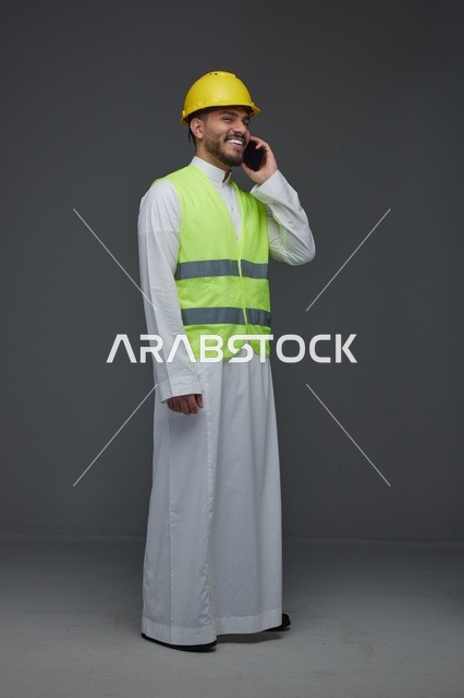 Saudi Engineer Talking on Phone in Safety Gear
