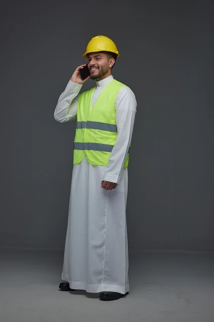 Saudi Engineer in Safety Vest Talking on Mobile Phone