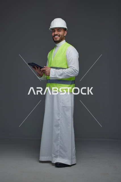 Saudi Engineer with Tablet and Safety Gear