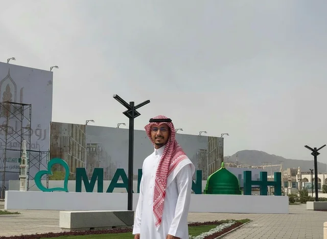 Saudi Man in Traditional Thobe at Madinah Landmark