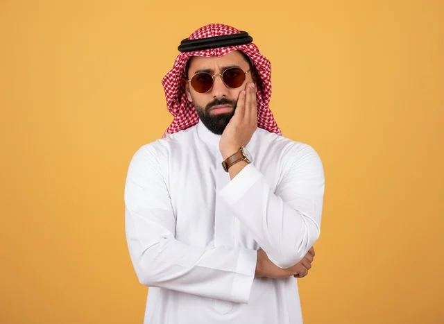 Saudi Man in Traditional Dress with Sunglasses