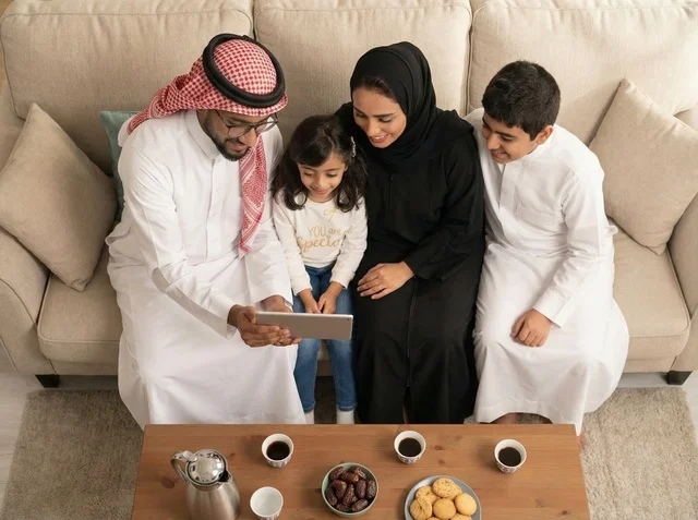 Saudi Family Using Tablet in Living Room