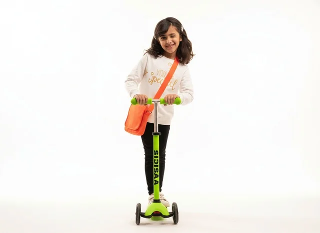 Saudi Girl with Green Scooter on White Background