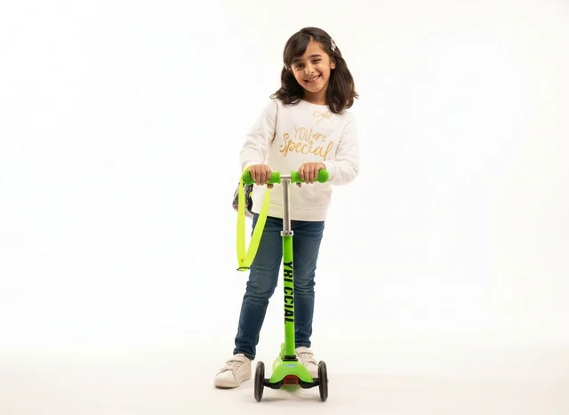 Saudi Girl with Green Scooter on White Background